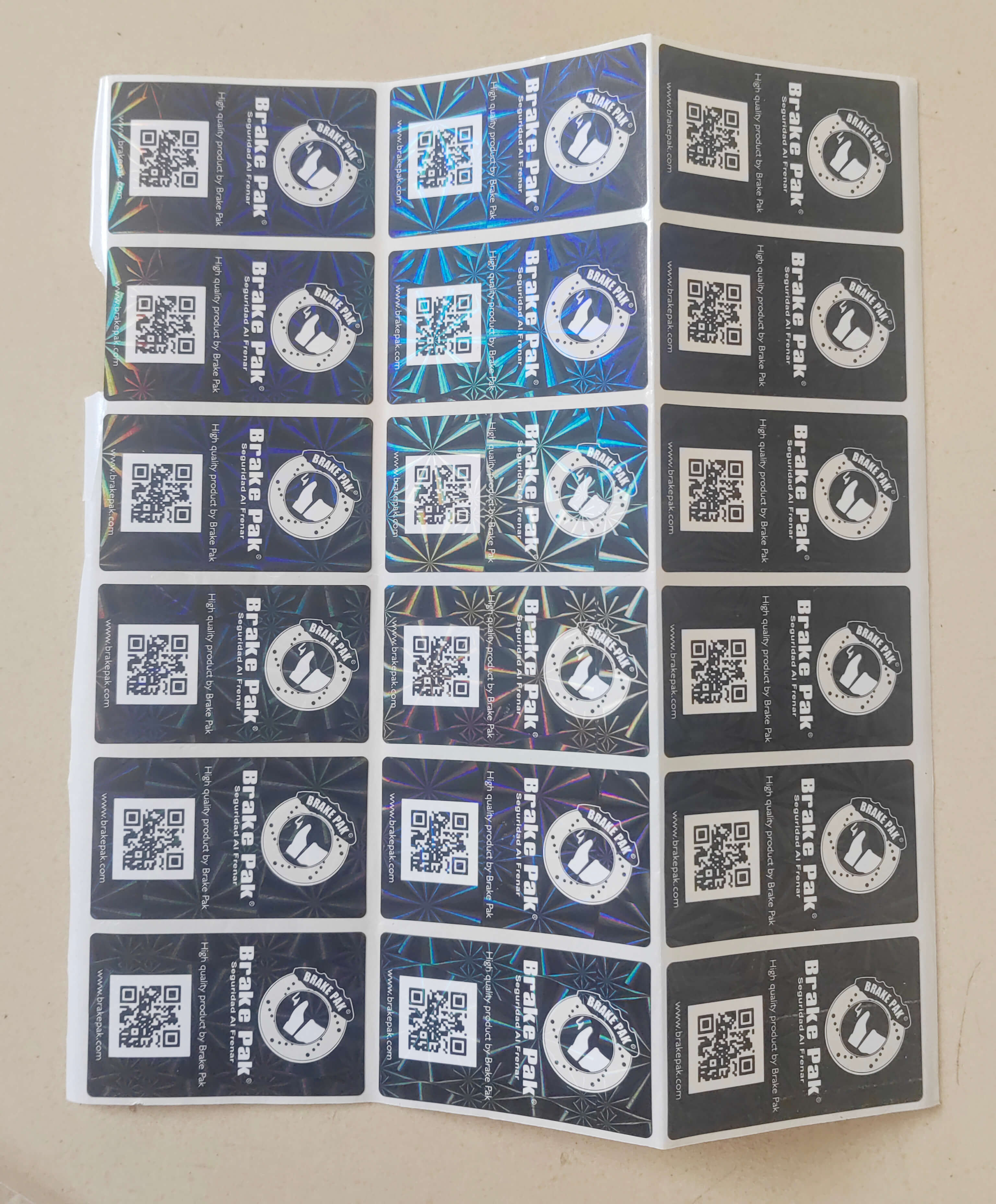 Adhesive sticker with anti-counterfeiting film-1